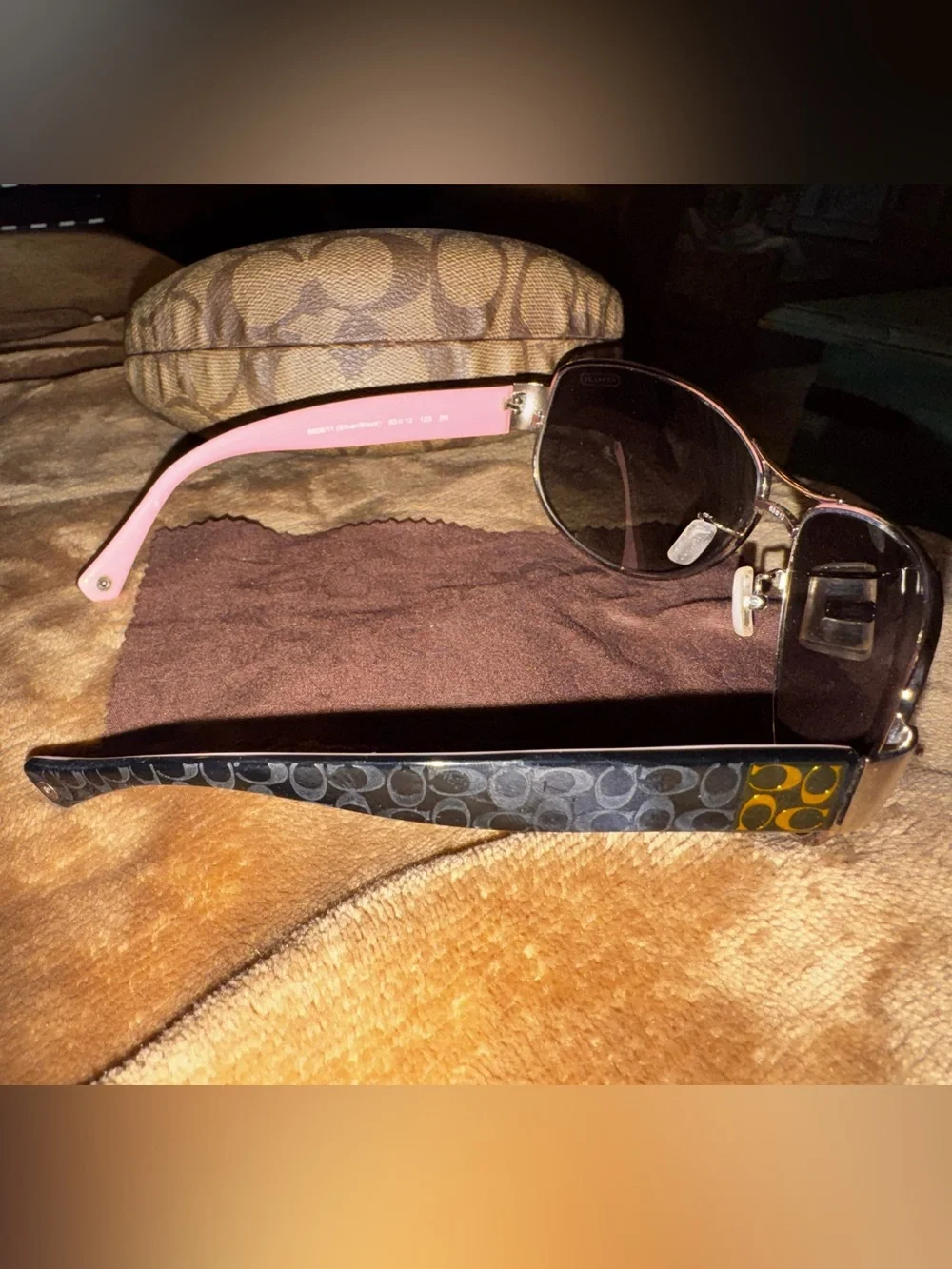Coach aviator sunglasses with brown lenses and pink temples